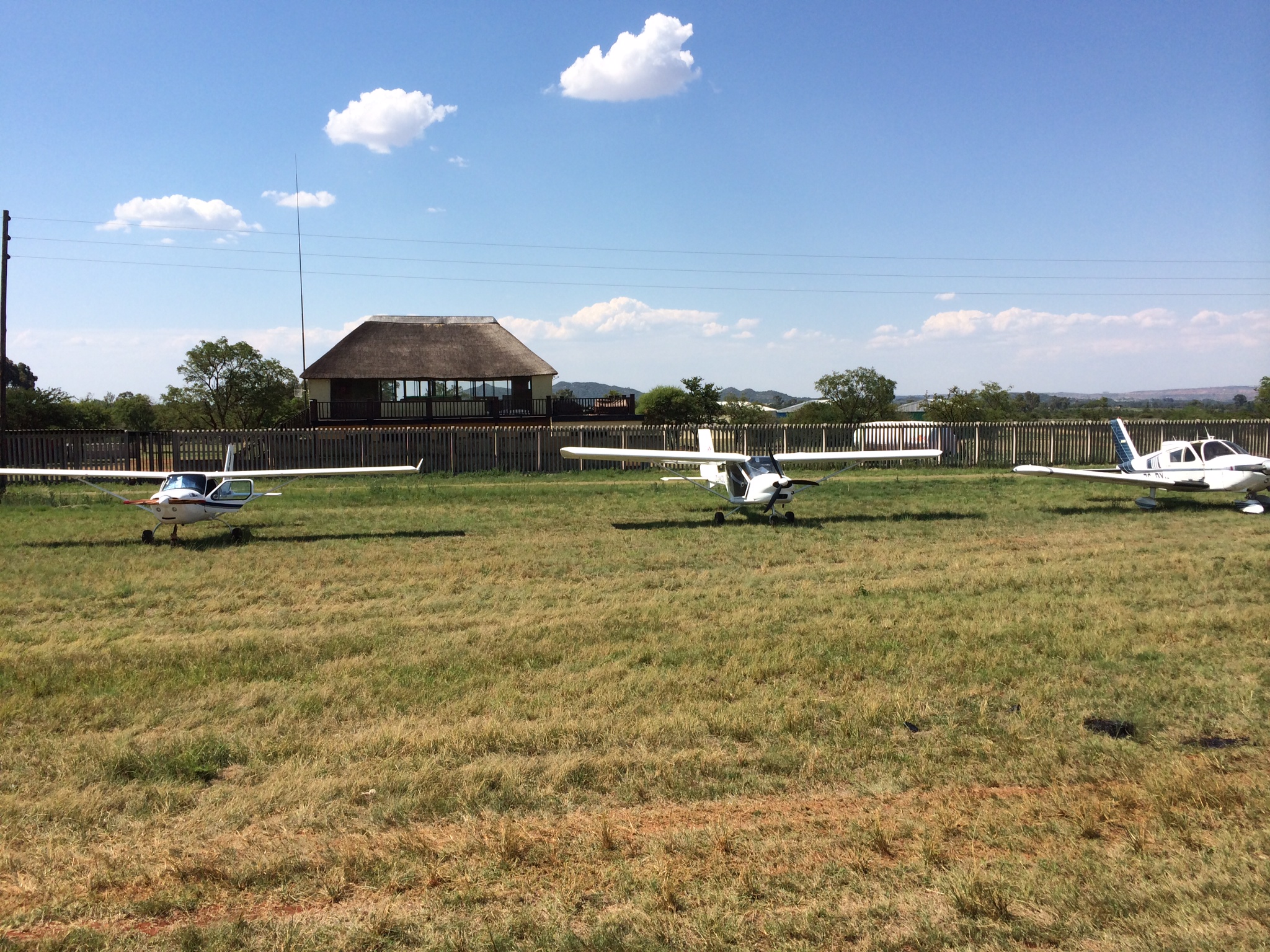 The thatched clubhouse overlooking the airfield