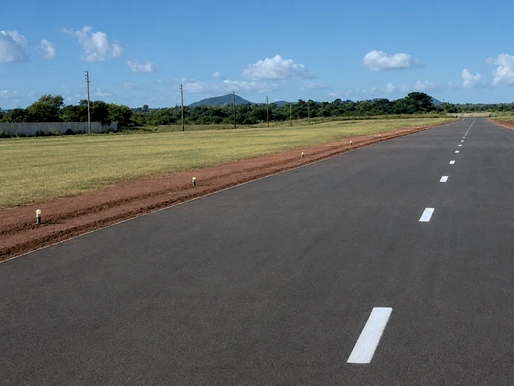 The tarred runway 09/27 looking toward the hills